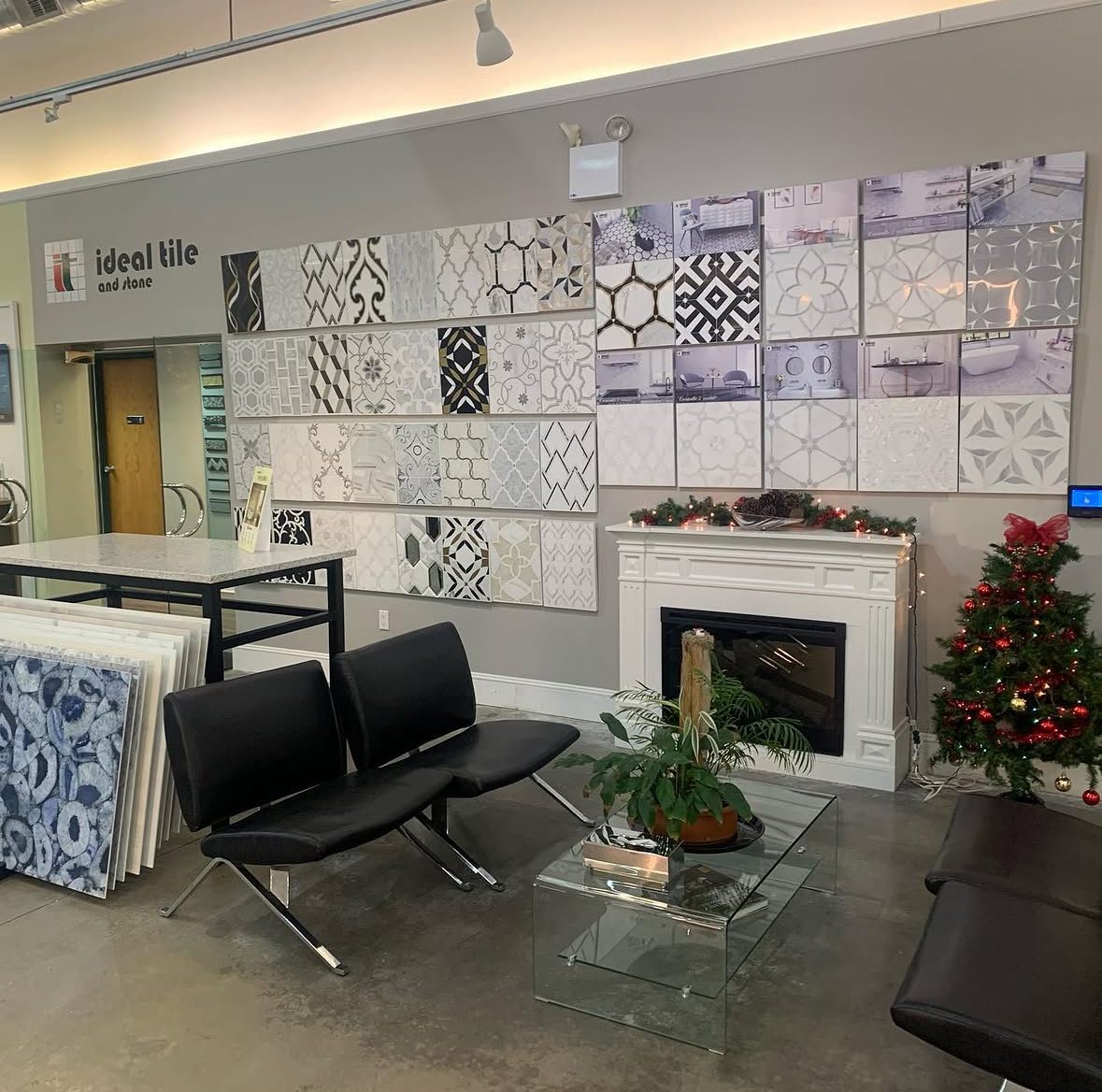 Our Fairfield showroom: a wall of decorative marble and waterjet tile beside a seating area