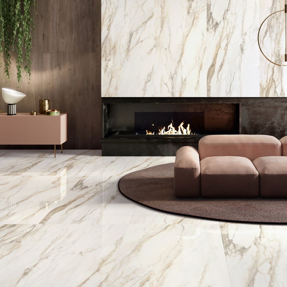 Living room with a polished Livorno Gold floor and fireplace wall